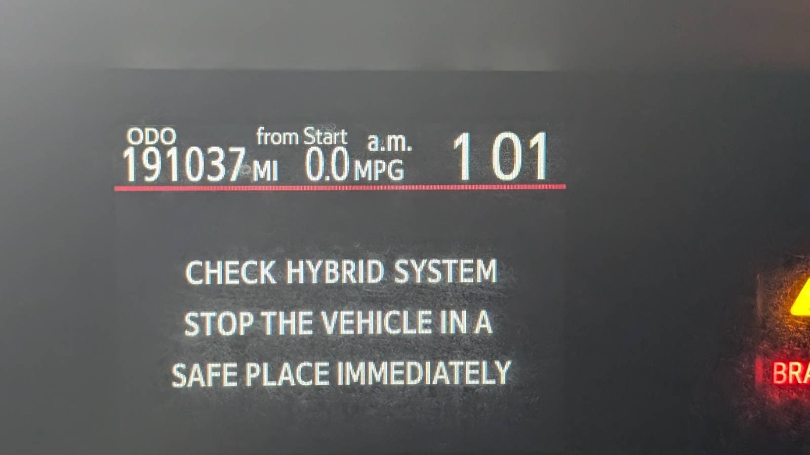 dashboard showing CHECK HYBRID SYSTEM message at 191,037 miles
