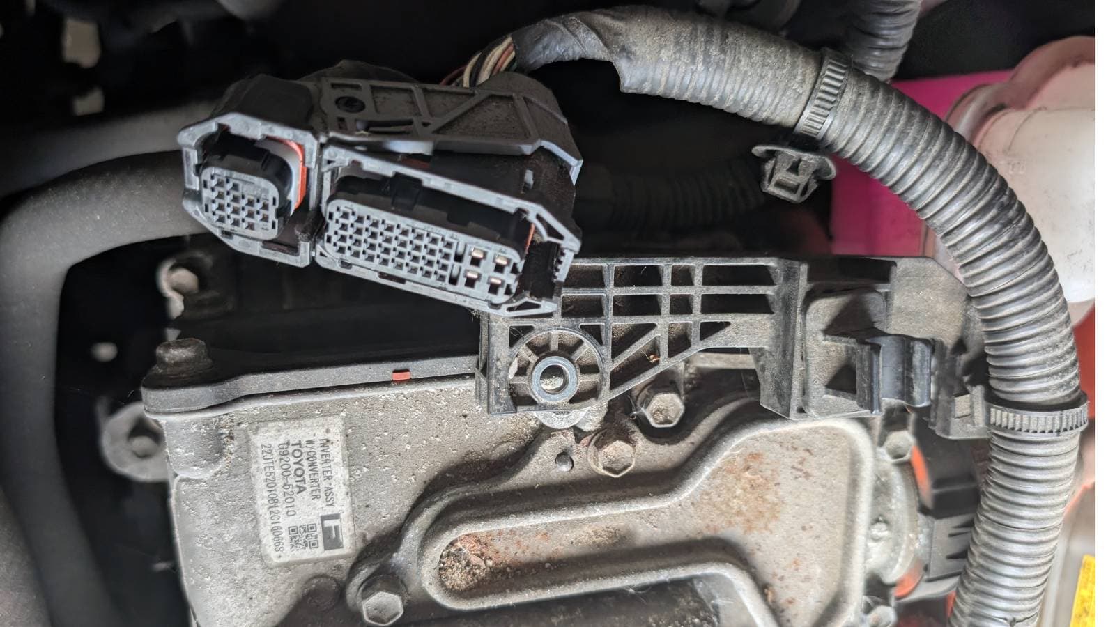 low-voltage connectors disconnected from the inverter assembly during the manual-prescribed verification step