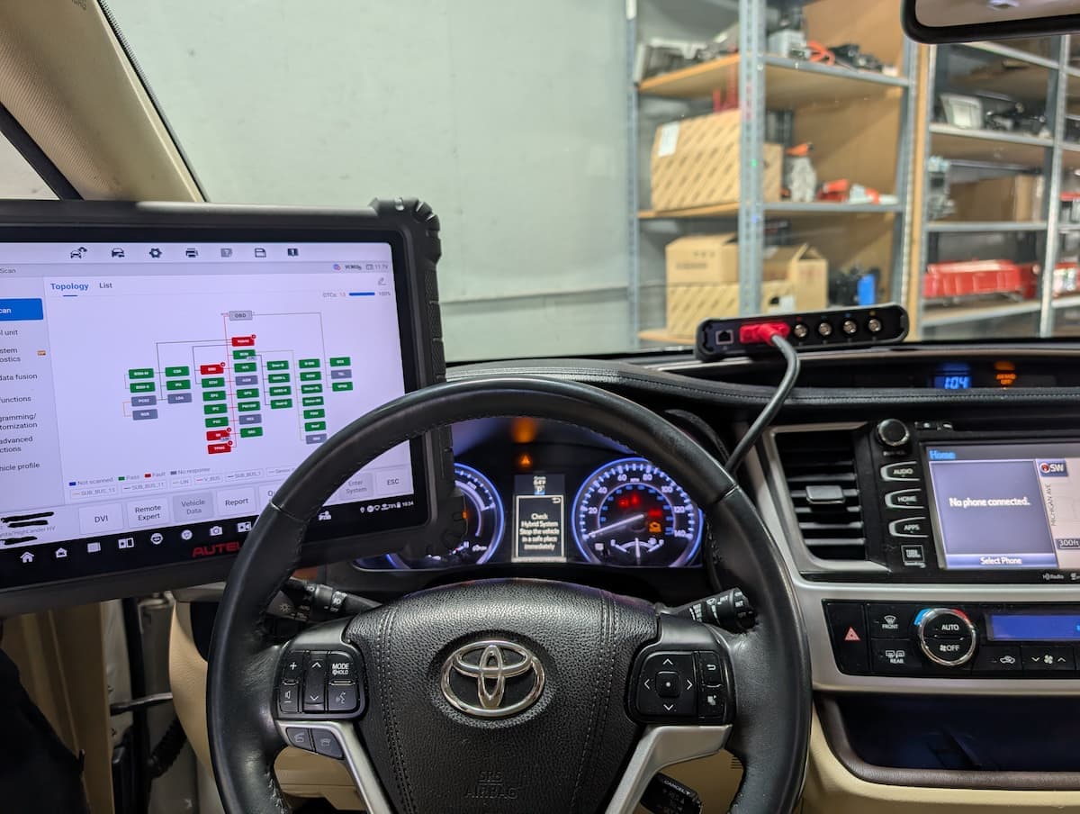 Hybrid diagnostic scanner showing Toyota Prius hybrid system topology with fault detected