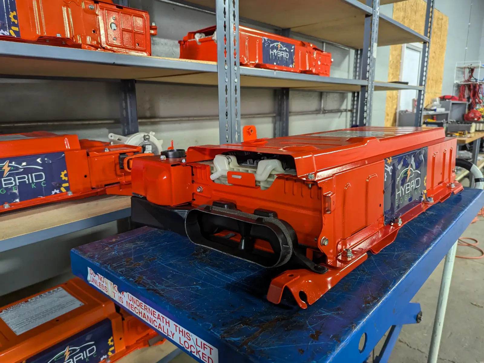 Hybrid Edge KC orange refurbished battery pack on shop cart